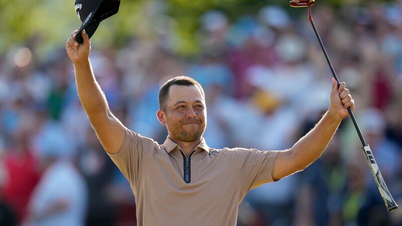 Xander Schauffele celebrates after winning the PGA Championship golf tournament at the...